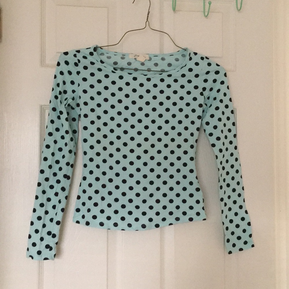 Mint blue polka dotted long sleeve top.